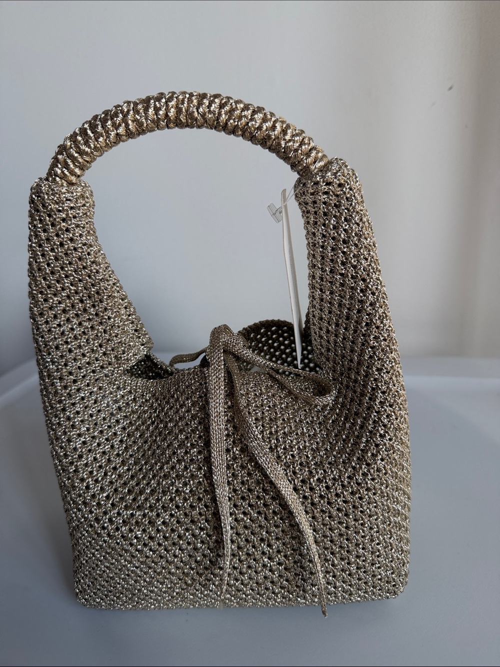 Glittery  open-knit handbag  brand new never worn. It's on store now.